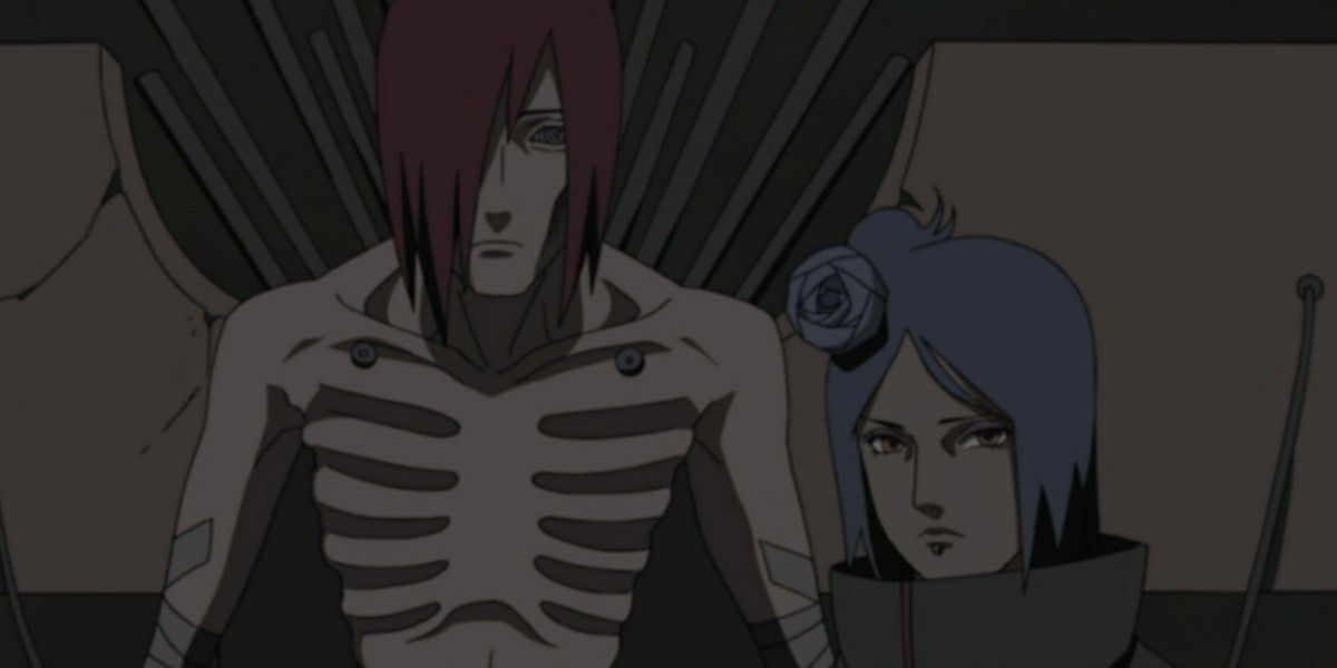 Konan (right) stands beside Nagato/Pain (left) in Naruto.