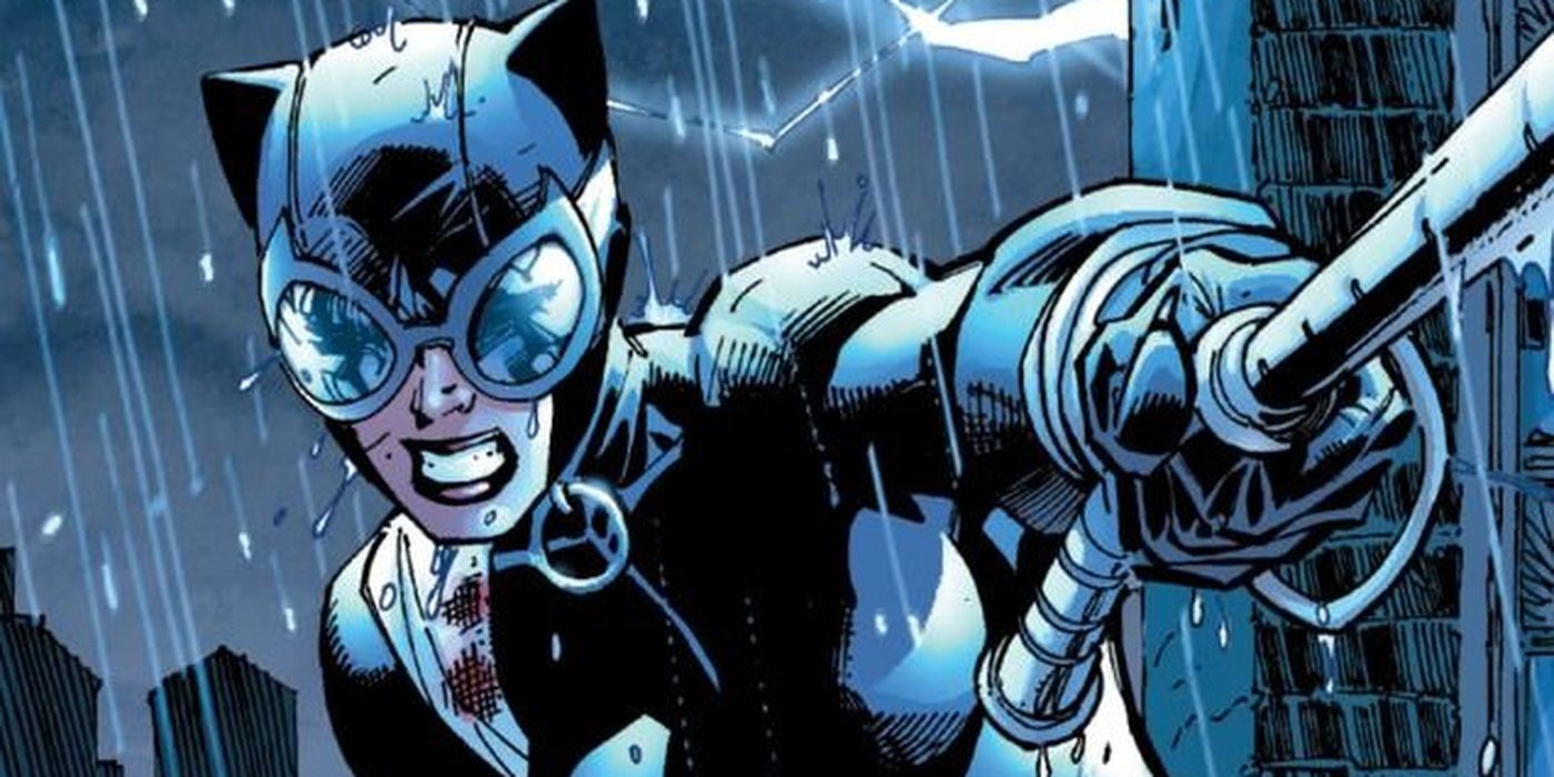 Catwoman uses her whip in the rain