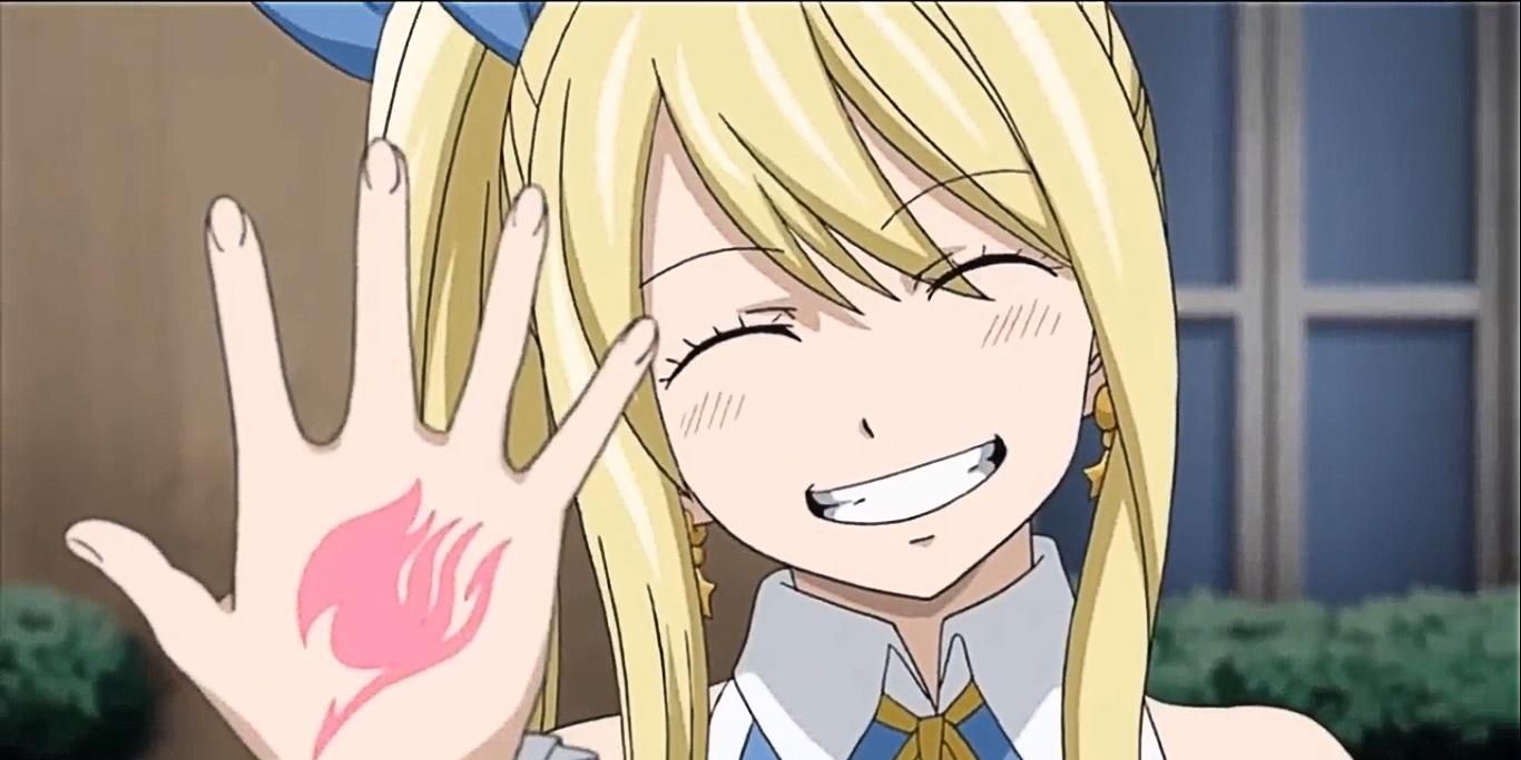 lucy heartfilia showing off her guild mark in fairy tail