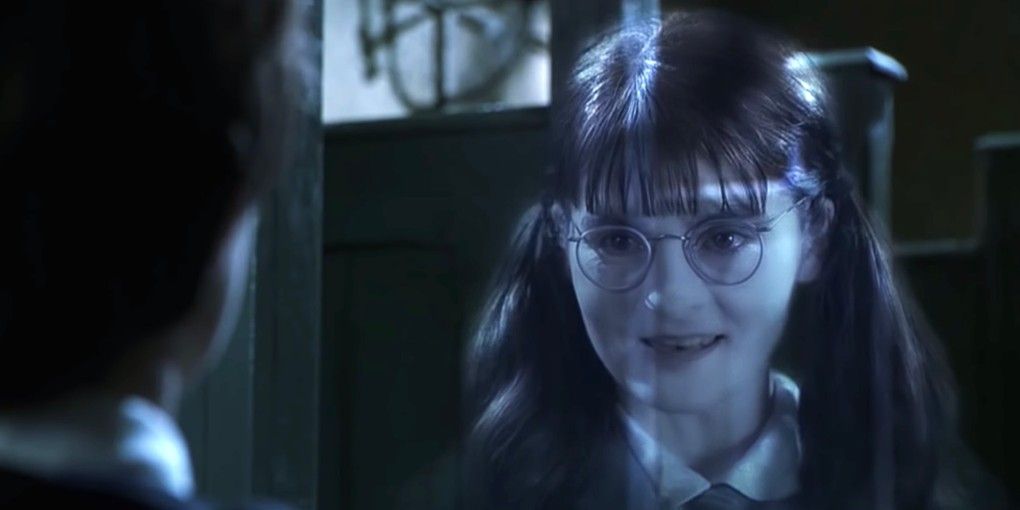 Moaning Myrtle talking to Harry Potter in her bathroom