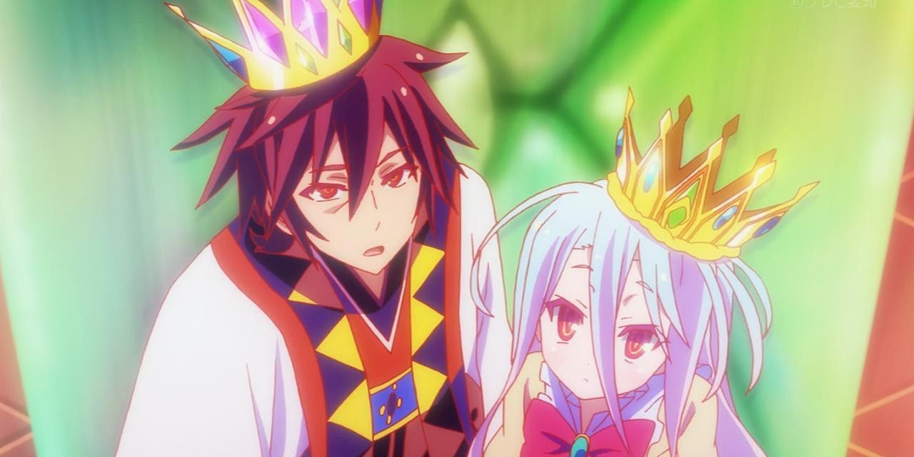 Sora and Shiro from No Game No Life sitting on a throne together wearing crowns.