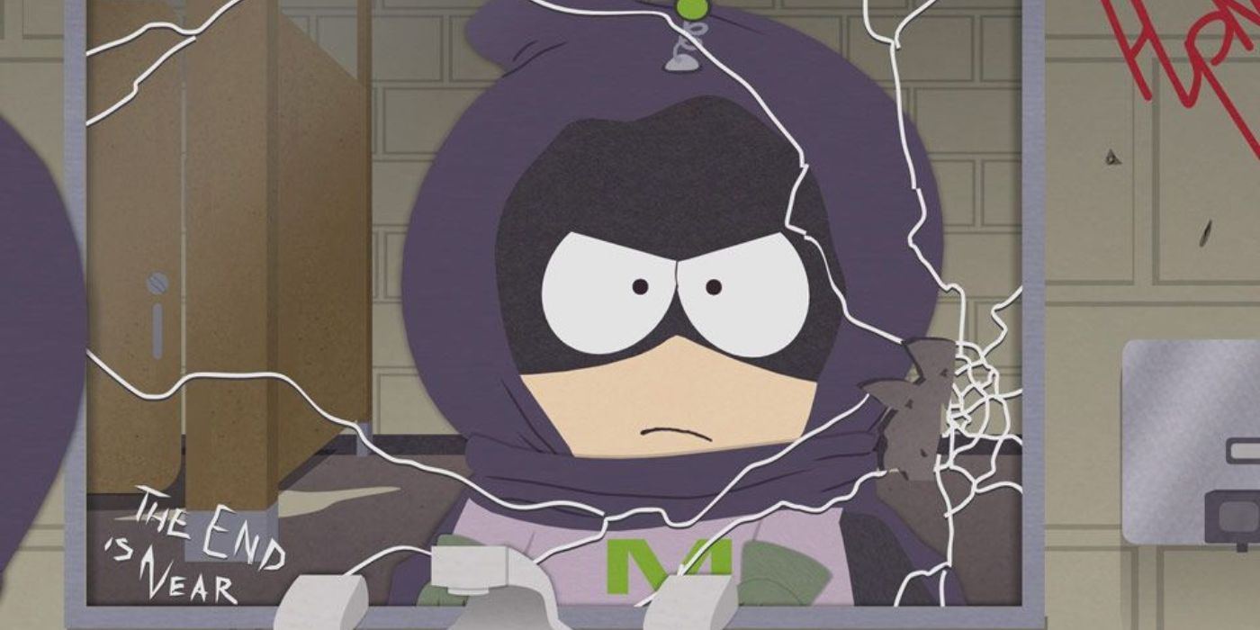 Kenny stares at himself in a broken mirror while dressed in his Mysterion costume in South Park