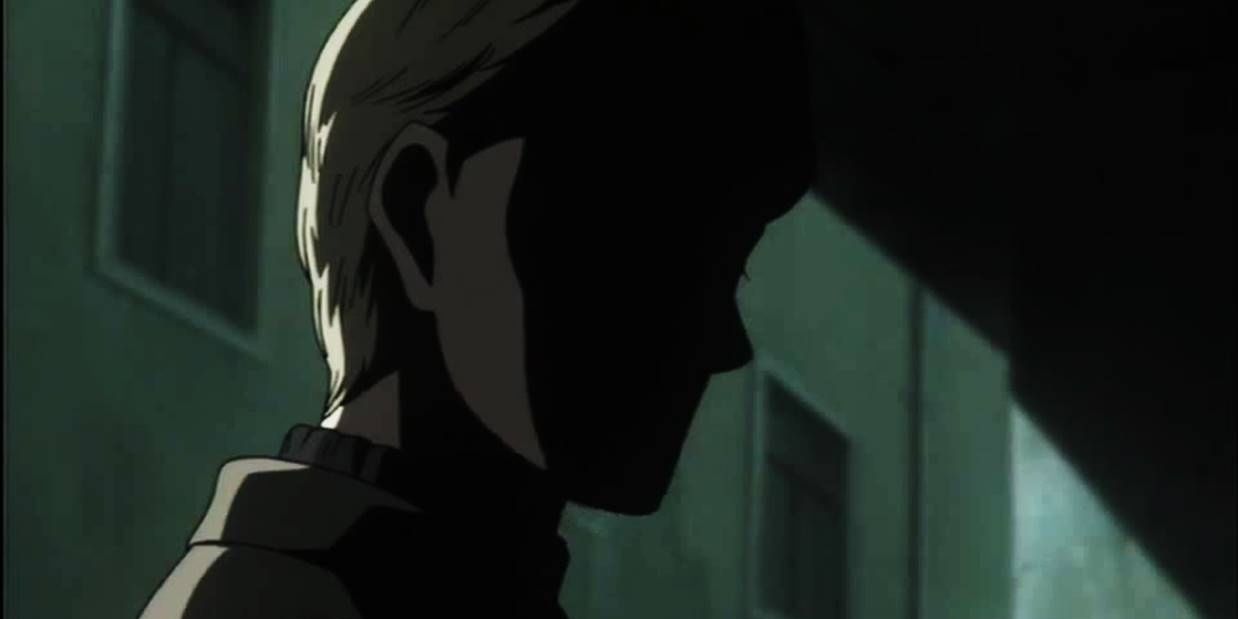 Johan Liebert in an alleyway, his face masked by shadow