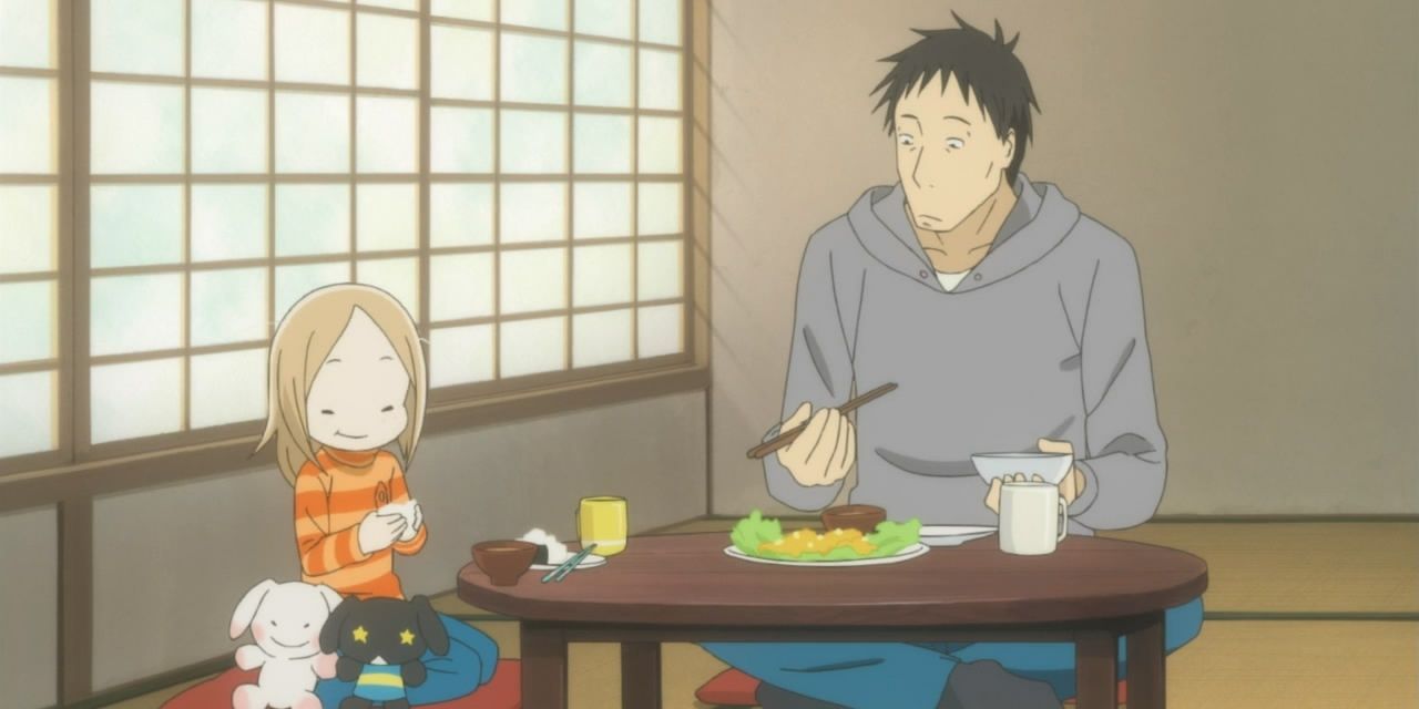 Daikichi and Rin eating dinner in Usagi Drop.