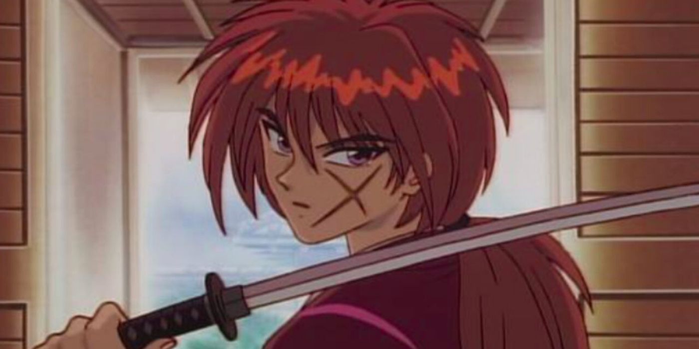 Kenshin holds his sword over his shoulder in Rurouni Kenshin.