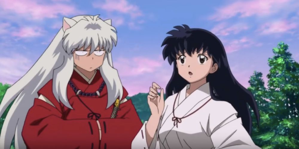 Inuyasha looking quizzically at Kagome who looks concerned from Inuyasha.