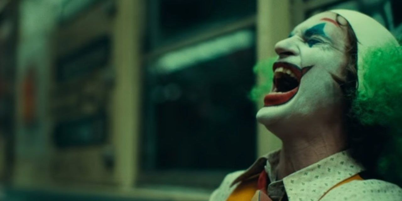 Joker (Joaquin Phoenix) laughing