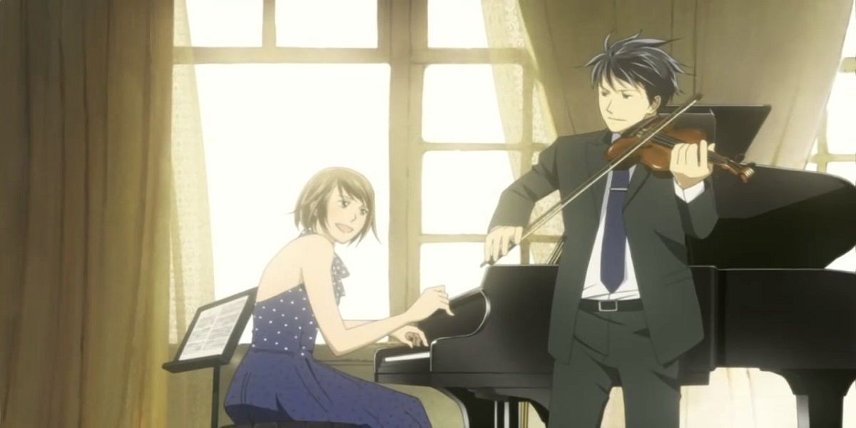 Chiaki is playing the violin while Nodame accompanies him on the piano.