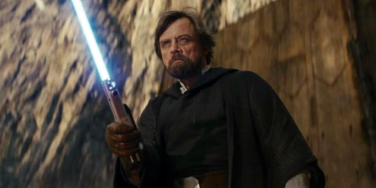 Mark Hamill as Luke Skywalker Brandishes His Blue Lightsaber in Star Wars: The Last Jedi