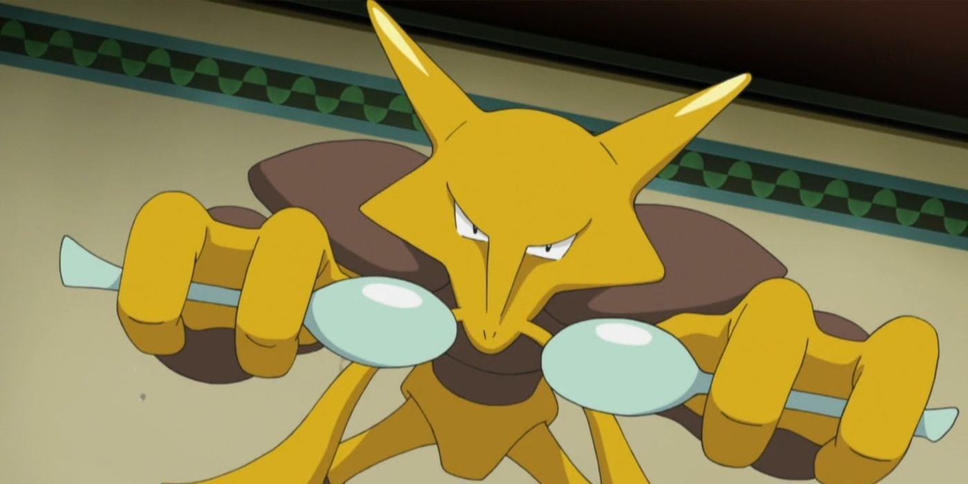 Alakazam de Pokémon tient une cuillère et regarde fixement.