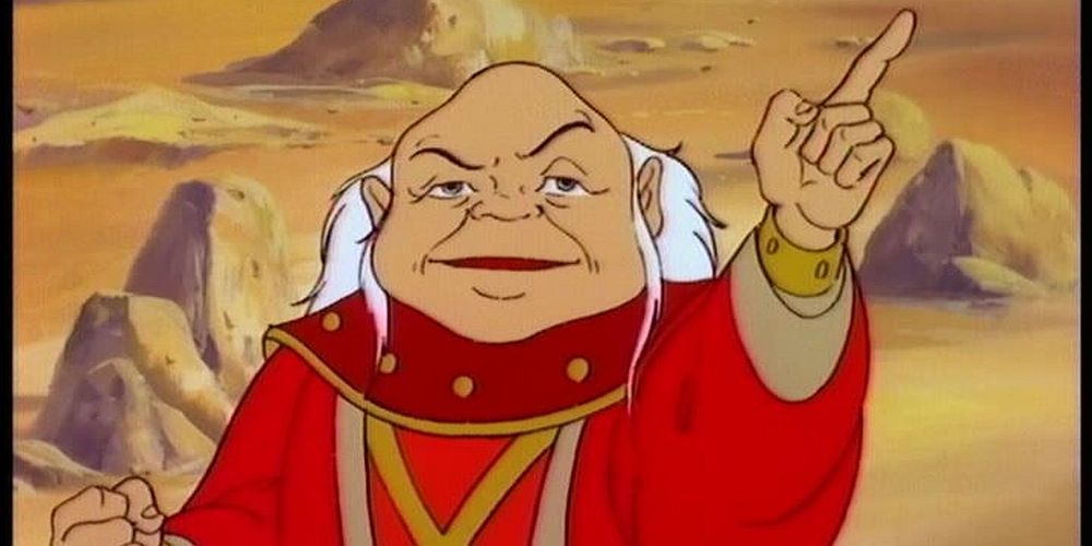 The Dungeon Master from the 1980s DnD cartoon pointing a finger upward.