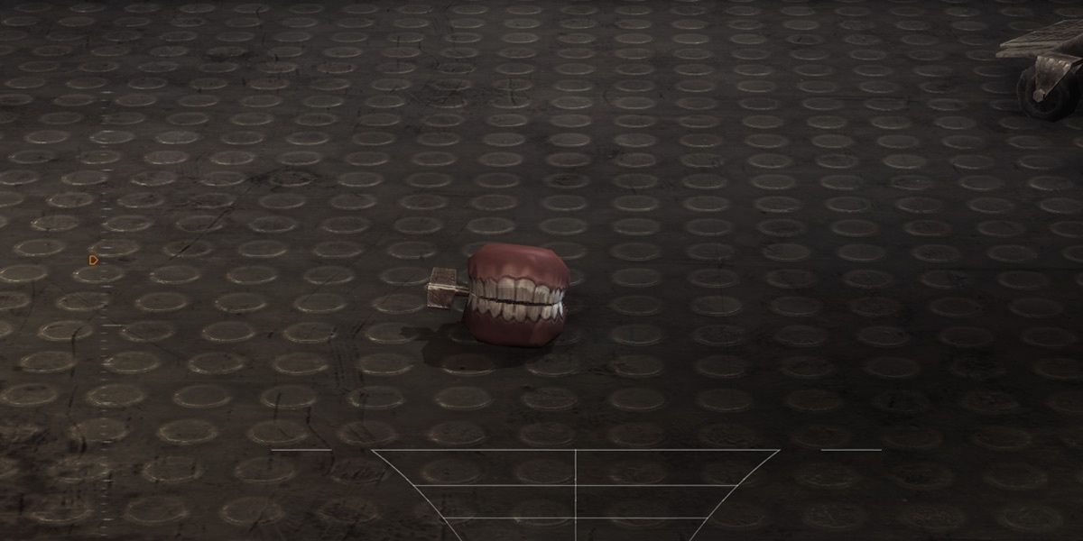 An image of the Joker's chattering teeth on the floor in the Batman: Arkham games