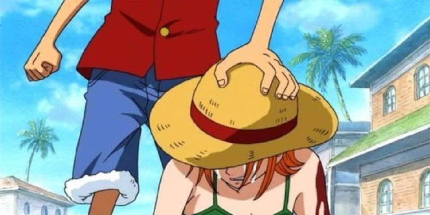 Image shows Monkey D. Luffy comforting a crying Nami - One Piece