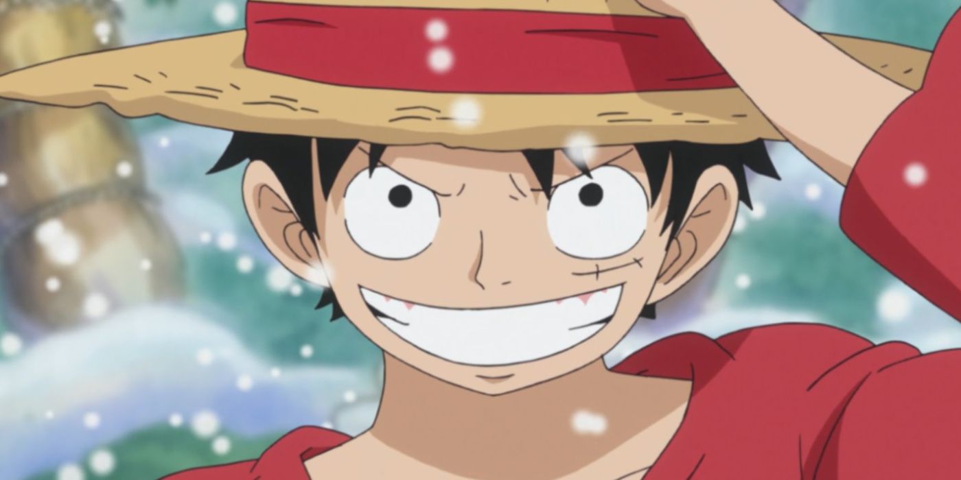 Luffy from One Piece touching the crown of his hat and smiling.