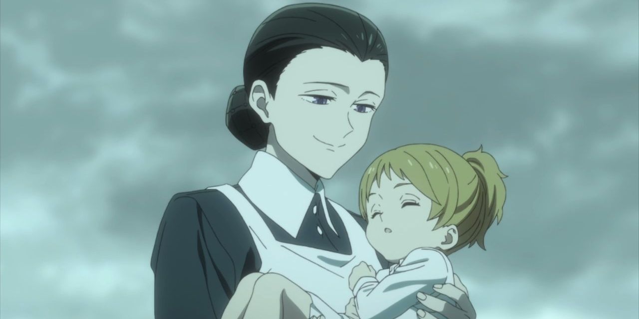 Isabella carries a sleeping child