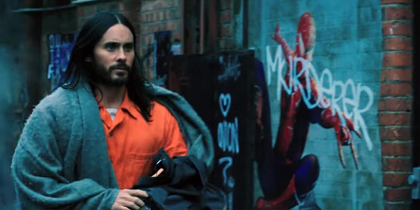 Morbius running past a graffitied picture of Spider-Man