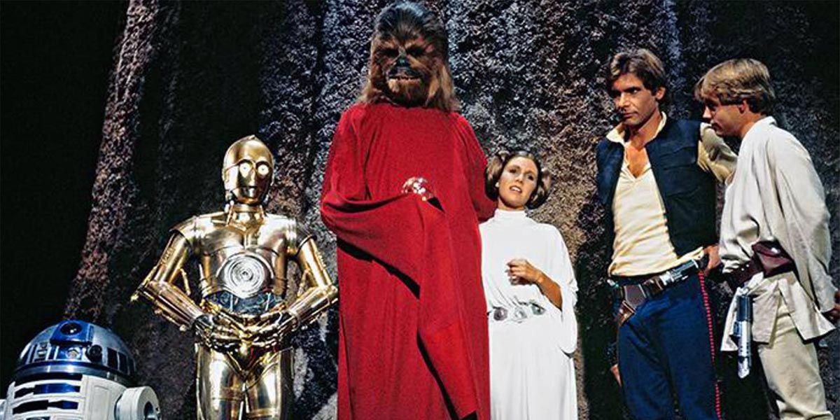 Scene from The Star Wars Holiday Special with R2, 3PO, Chewie, Leia, Han, and Luke