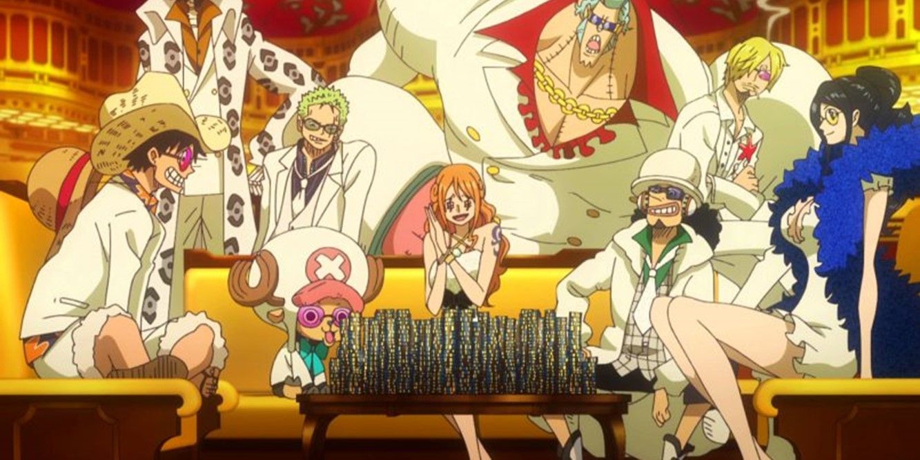 The Straw Hat pirates sitting on and around a gold sofa wearing fancy clothes.