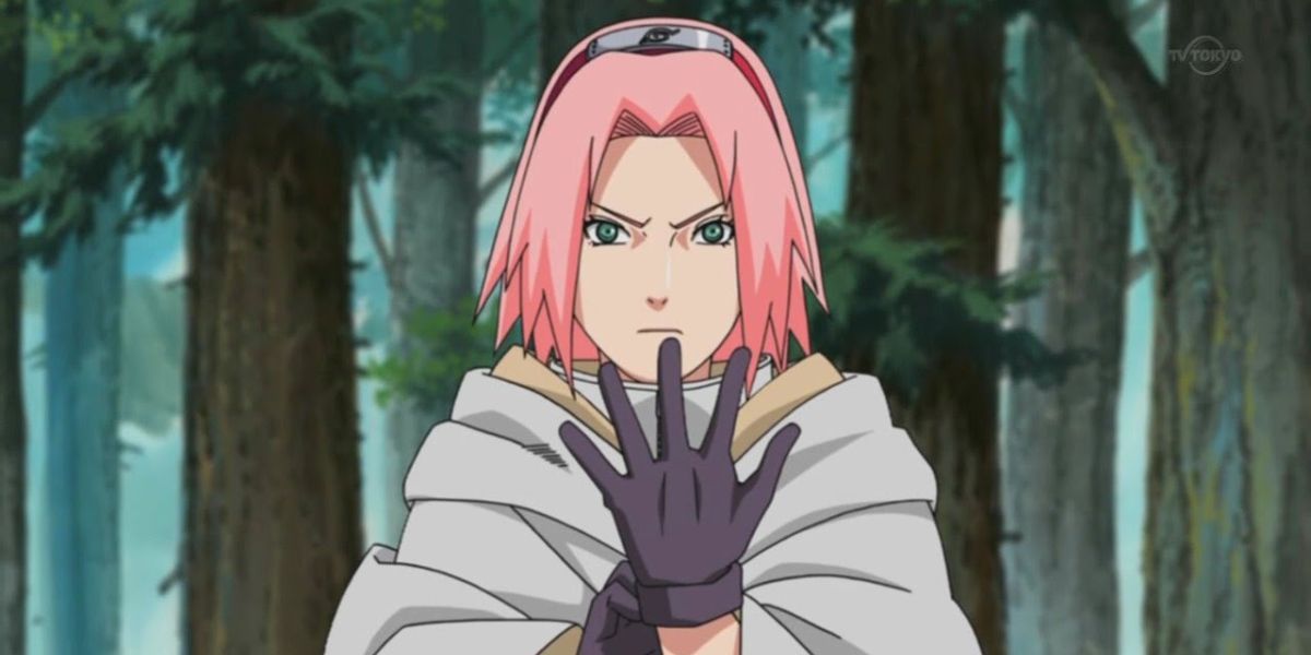 Sakura holding one of her gloved hands up