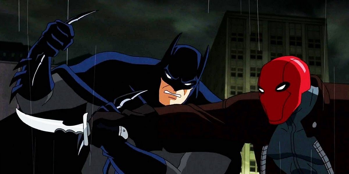 Batman and Red Hood fighting in the rain in Batman: Under The Red Hood