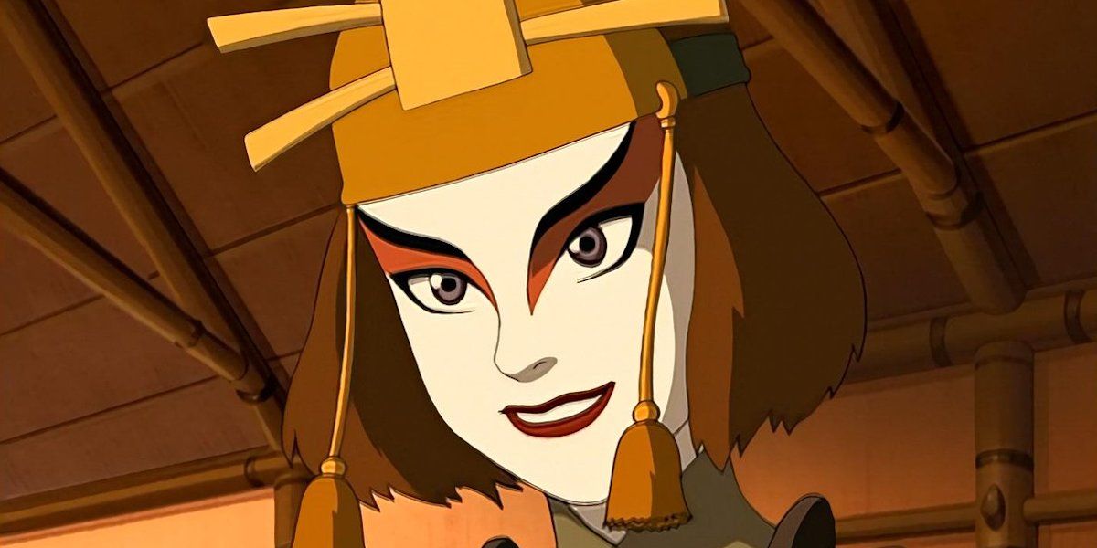 Kyoshi warrior Suki wearing a gold hat with tassels and grinning in ATLA.
