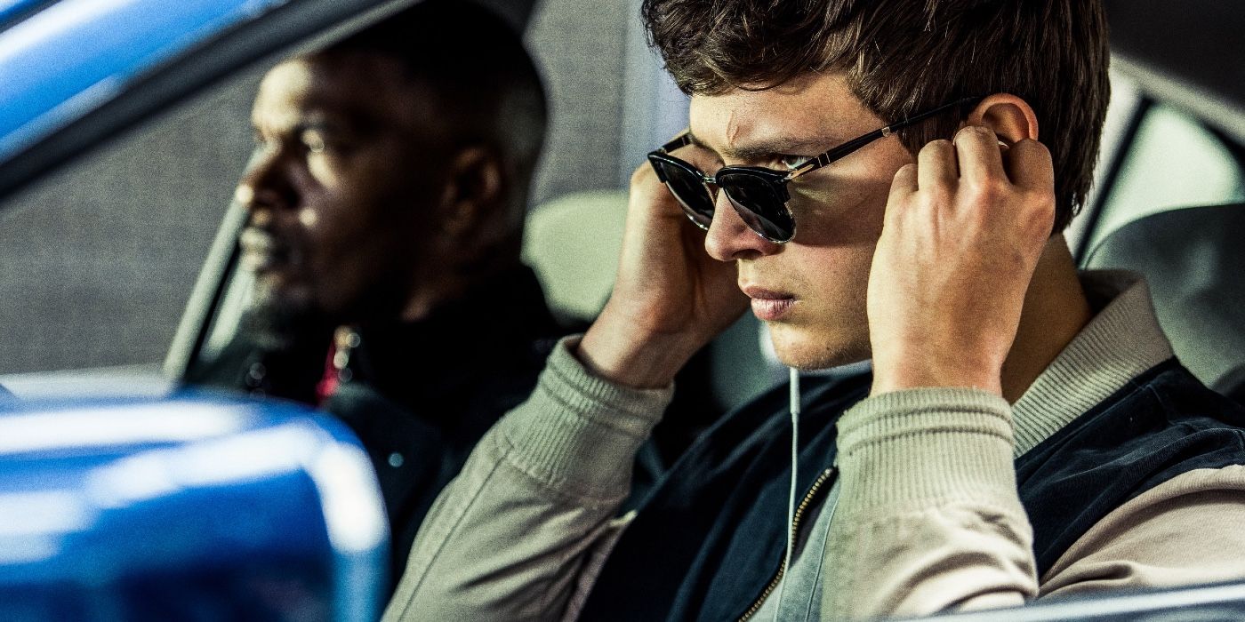 Ansel Elgort as Miles "Baby" getting ready for a heist.