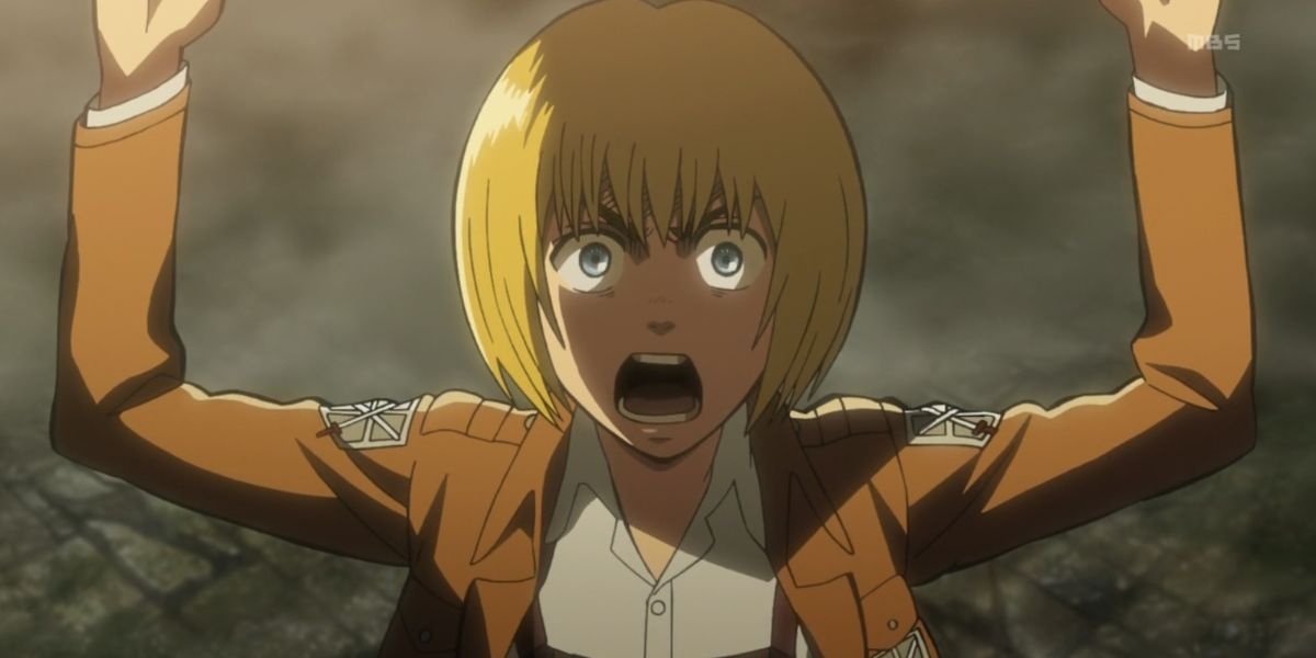 Armin protecting Eren and Mikasa in Attack on Titan.