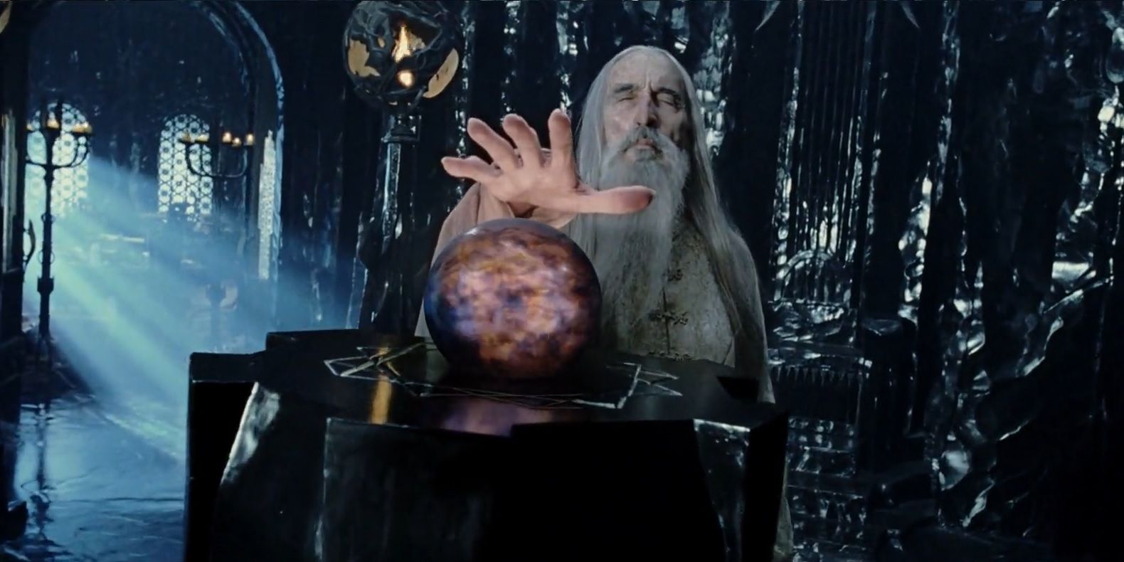 An image of the wizard Saruman using the Palantir in Lord of the Rings
