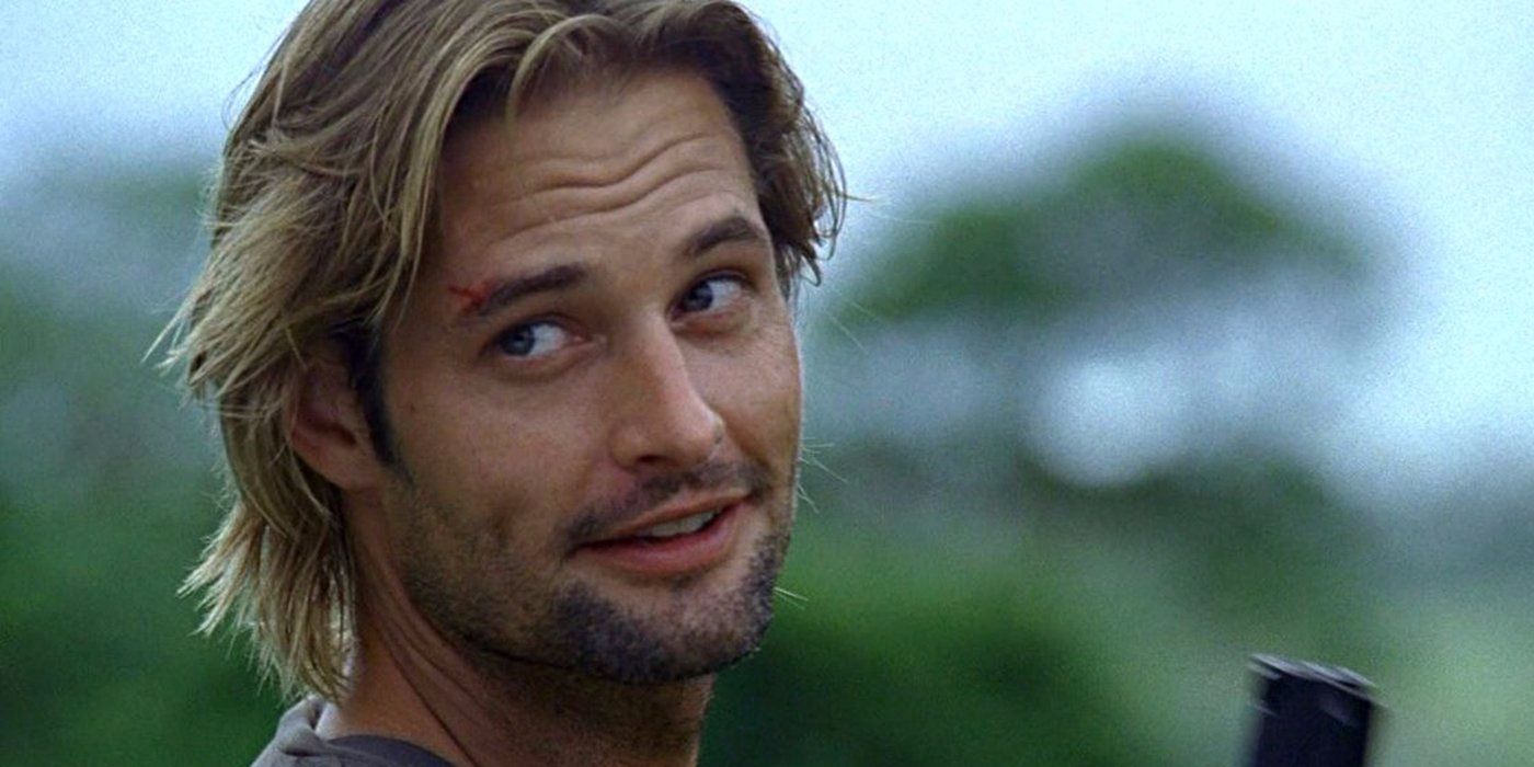 Sawyer smiles as he holds a gun on Lost