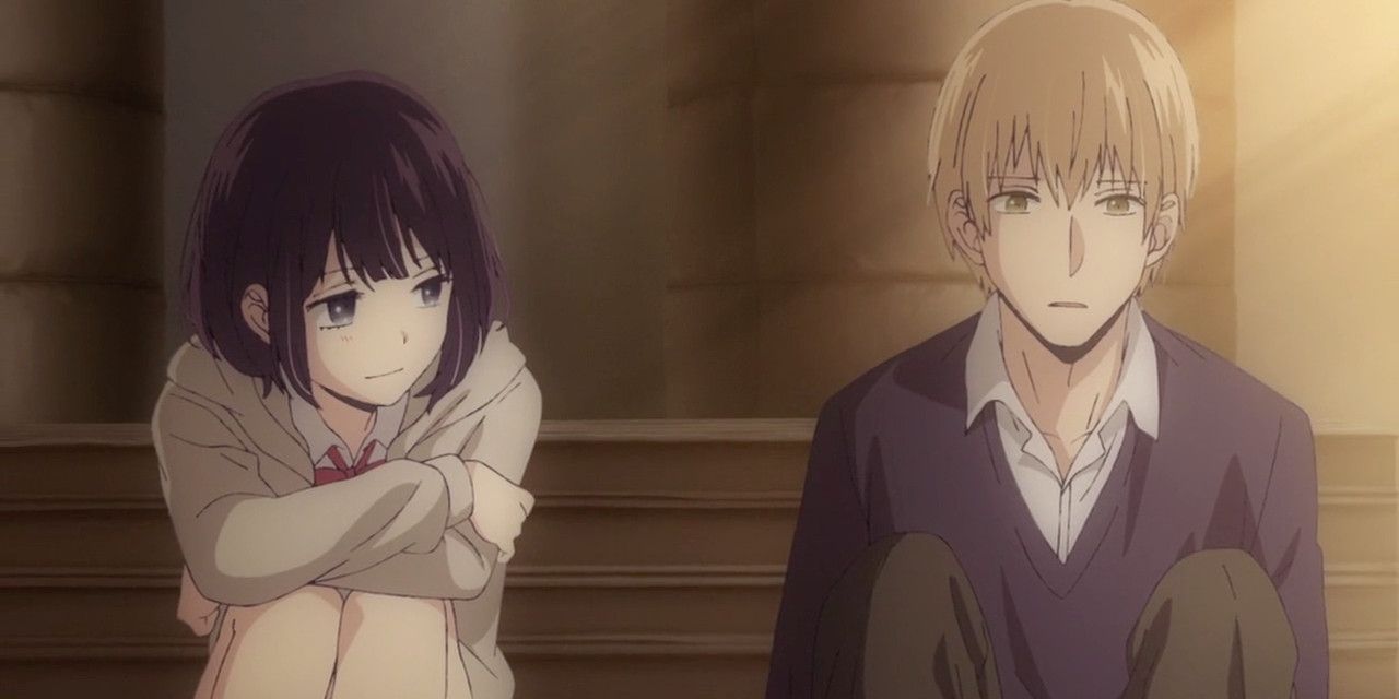Male and female characters from Scum's Wish sitting by each other.