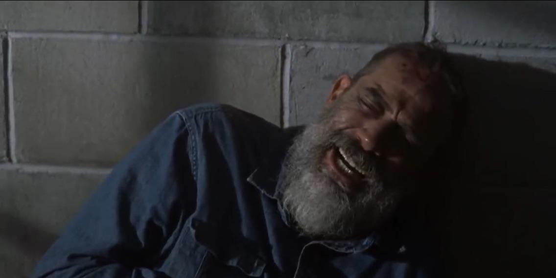 Negan (Jeffrey Dean Morgan) crying in a cell on The Walking Dead