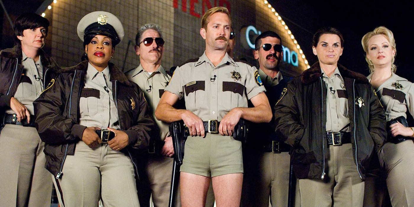 The cops of reno 911 all lined up and posing