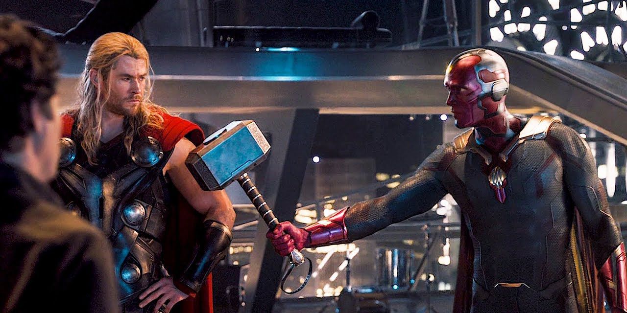 Vision handing Thor Mjolnir in Age of Ultron