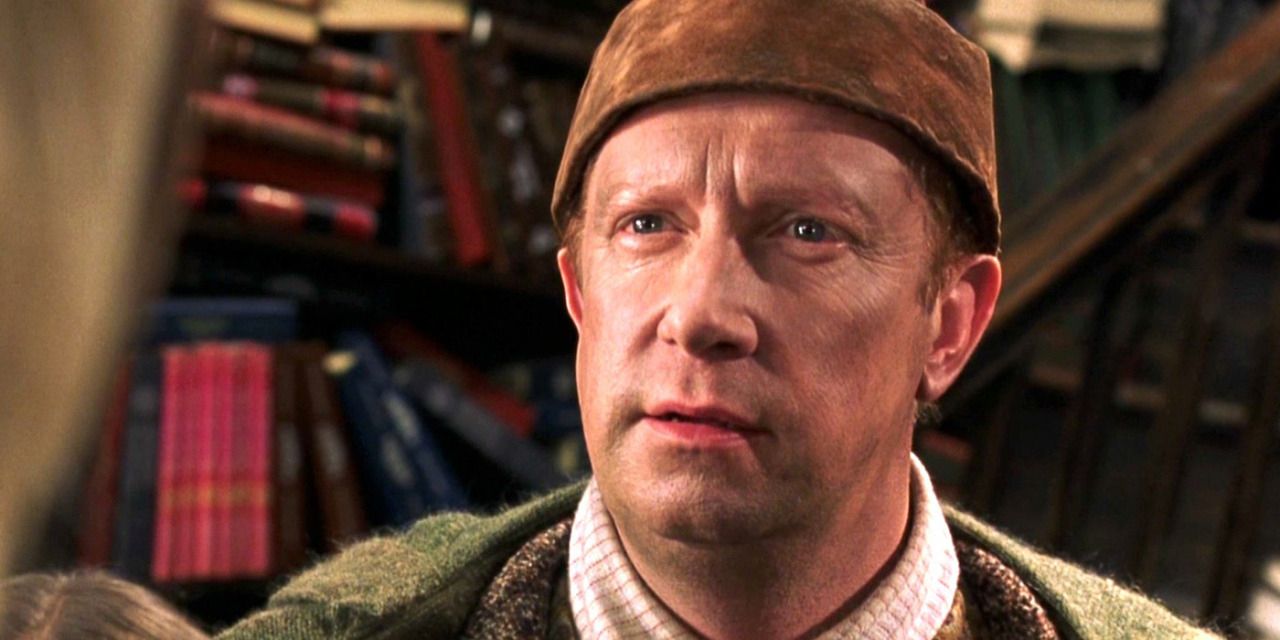 Arthur Weasley staring at Malfoy in bookshop