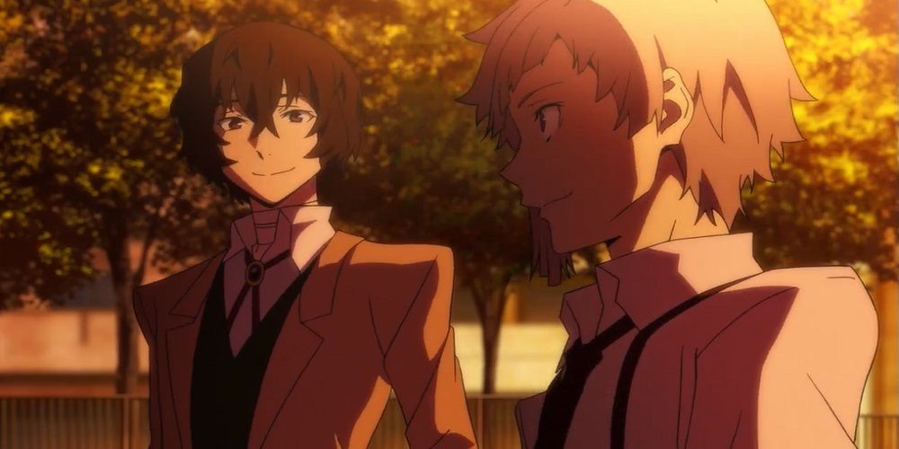 Dazai and Atsushi smile at each other as the sun sets in Bungo Stray Dogs