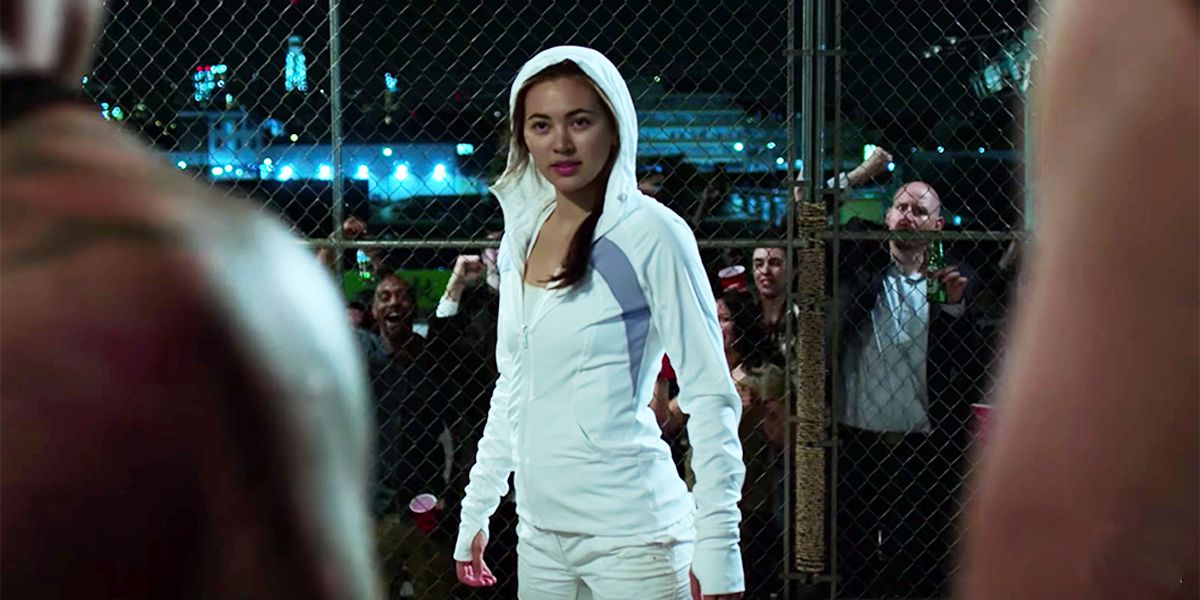 Colleen Wing prepares to fight two muscular men in an underground fight club
