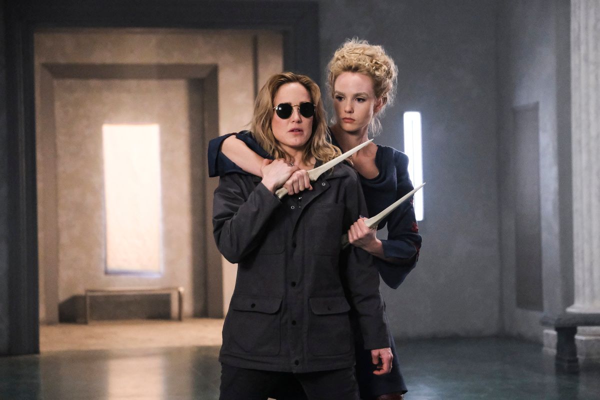 Legends of Tomorrow -- &quot;Swan Thong&quot; -- Image Number: LGN515a_0184b.jpg -- Pictured (L-R): Caity Lotz as Sara Lance/White Canary and Joanna Vanderham as Atropos -- Photo: Bettina Strauss/The CW -- © 2020 The CW Network, LLC. All Rights Reserved.