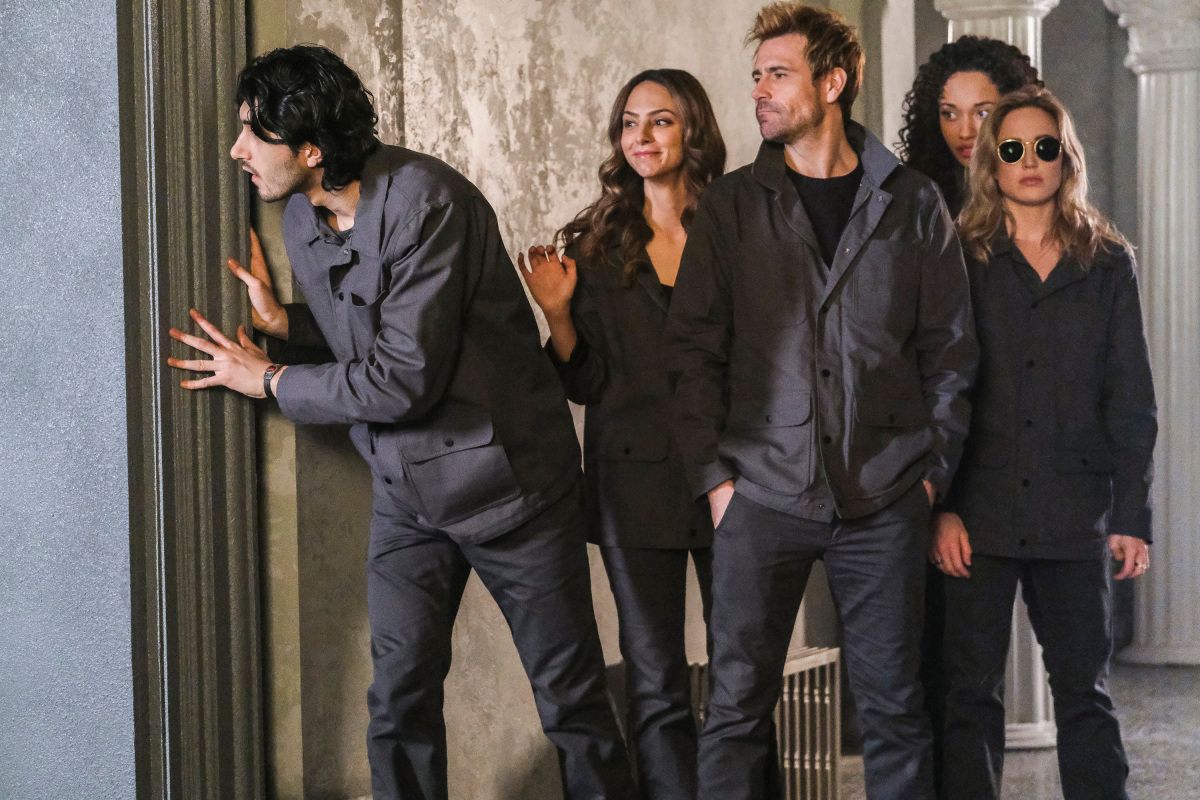 Legends of Tomorrow -- &quot;Swan Thong&quot; -- Image Number: LGN515a_0093b.jpg -- Pictured (L-R): Shayan Sobhian as Behrad Taraz, Tala Ashe as Zari, Matt Ryan as Constantine, Olivia Swan as Astra and Caity Lotz as Sara Lance/White Canary -- Photo: Bettina Strauss/The CW -- © 2020 The CW Network, LLC. All Rights Reserved.