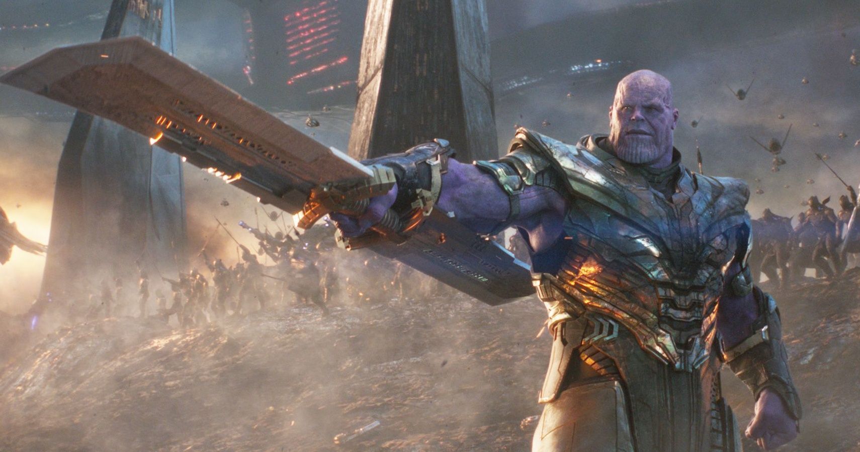 Thanos holding out his weapon and signaling his army to fight in Avengers: Endgame