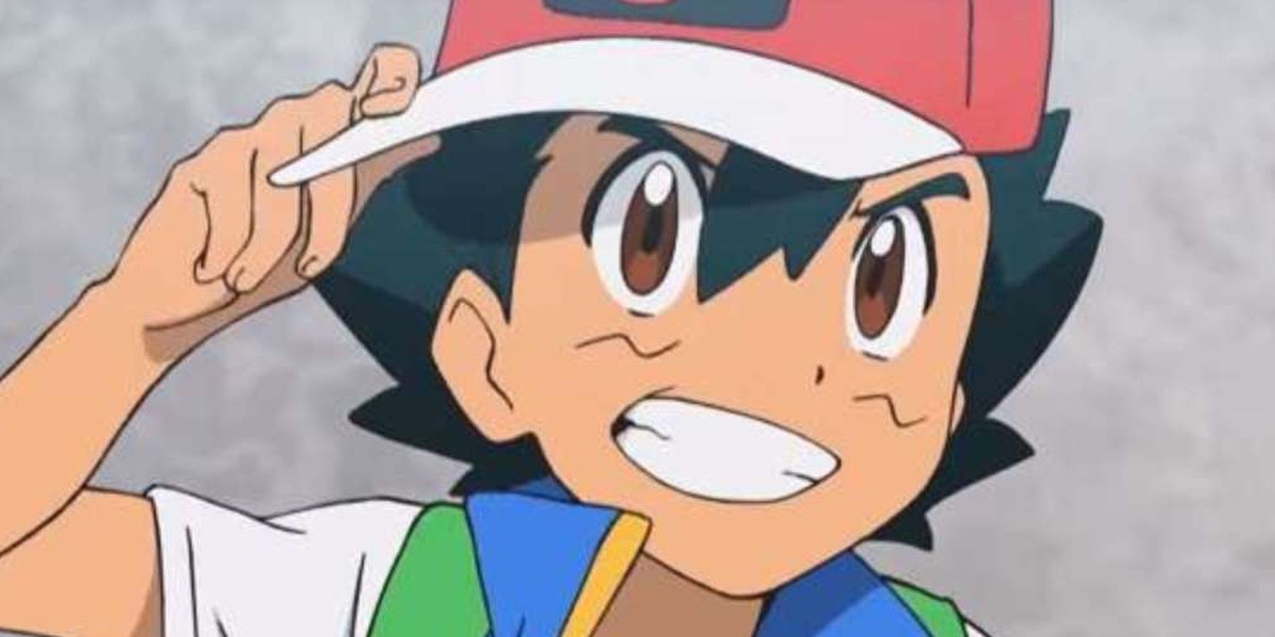 Pokemon Ash Ketchum grinning while turning his hat