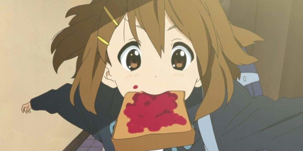 Yui Hirasawa from K-On! running with toast in her mouth.