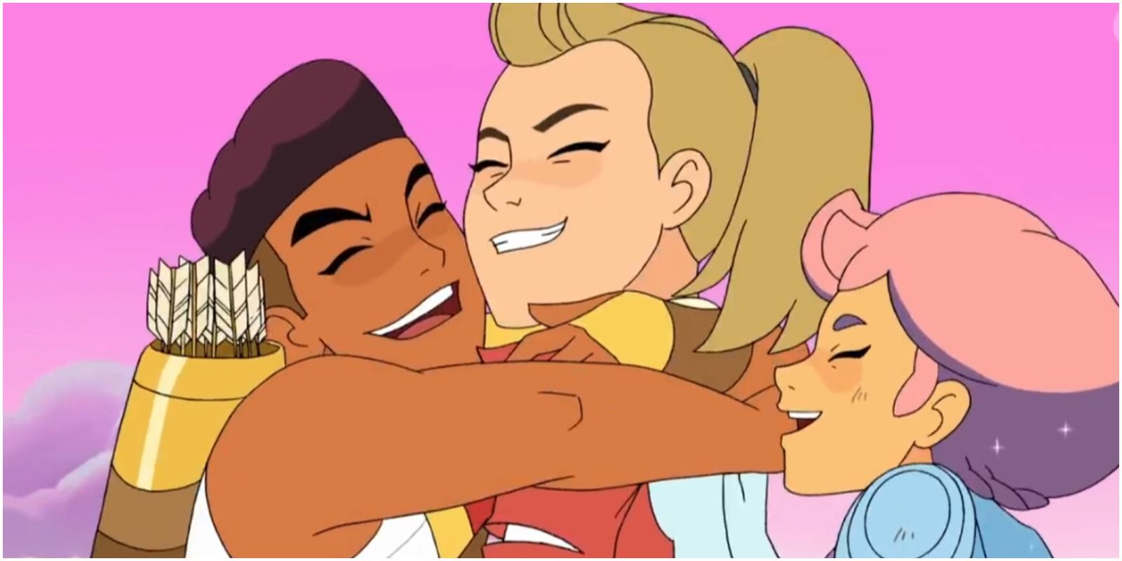 Adora, Bow, and Glimmer hug in She-Ra and the Princess of Power
