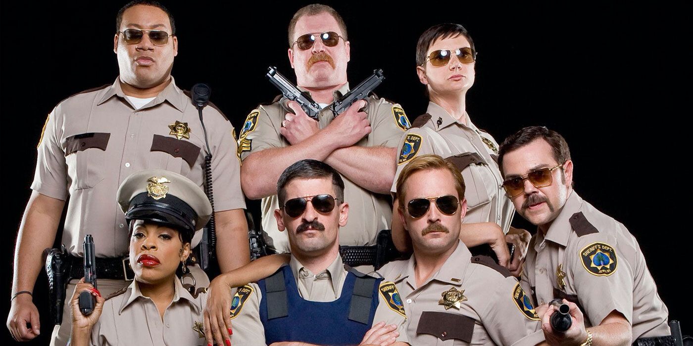 Paul Walter Hauser with the cast of Reno 911