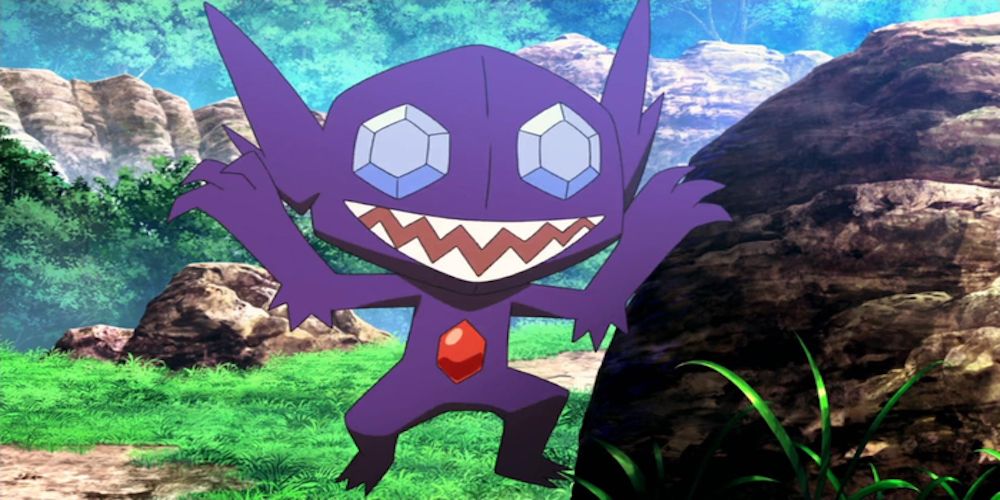 Sableye from Pokemon leaping from a boulder