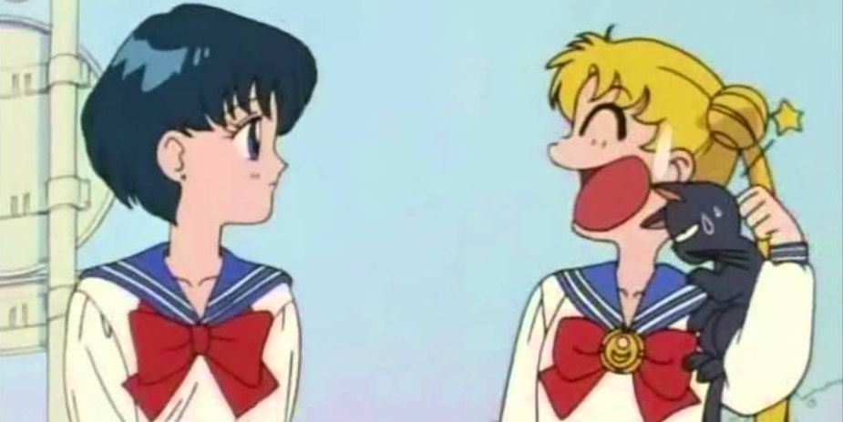 Ami and Usagi from Sailor Moon with Luna on Usagi's shoulder