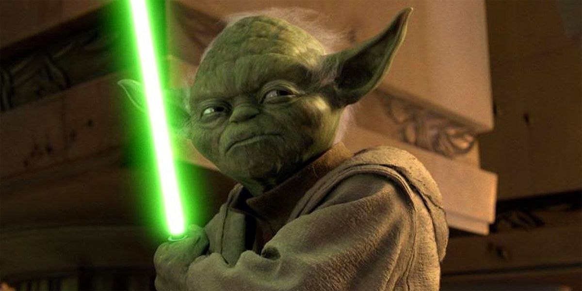 Yoda stands with his lightsaber open in the Revenge of the Sith