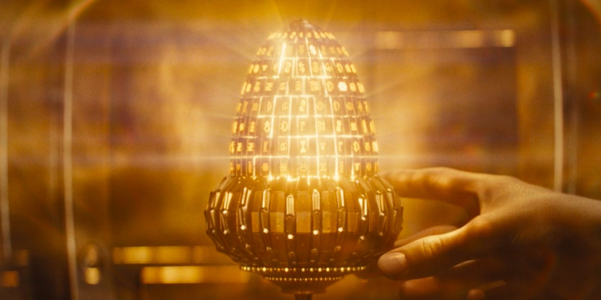 The Aculos, which looks like an upside-down golden acorn covered in runes.