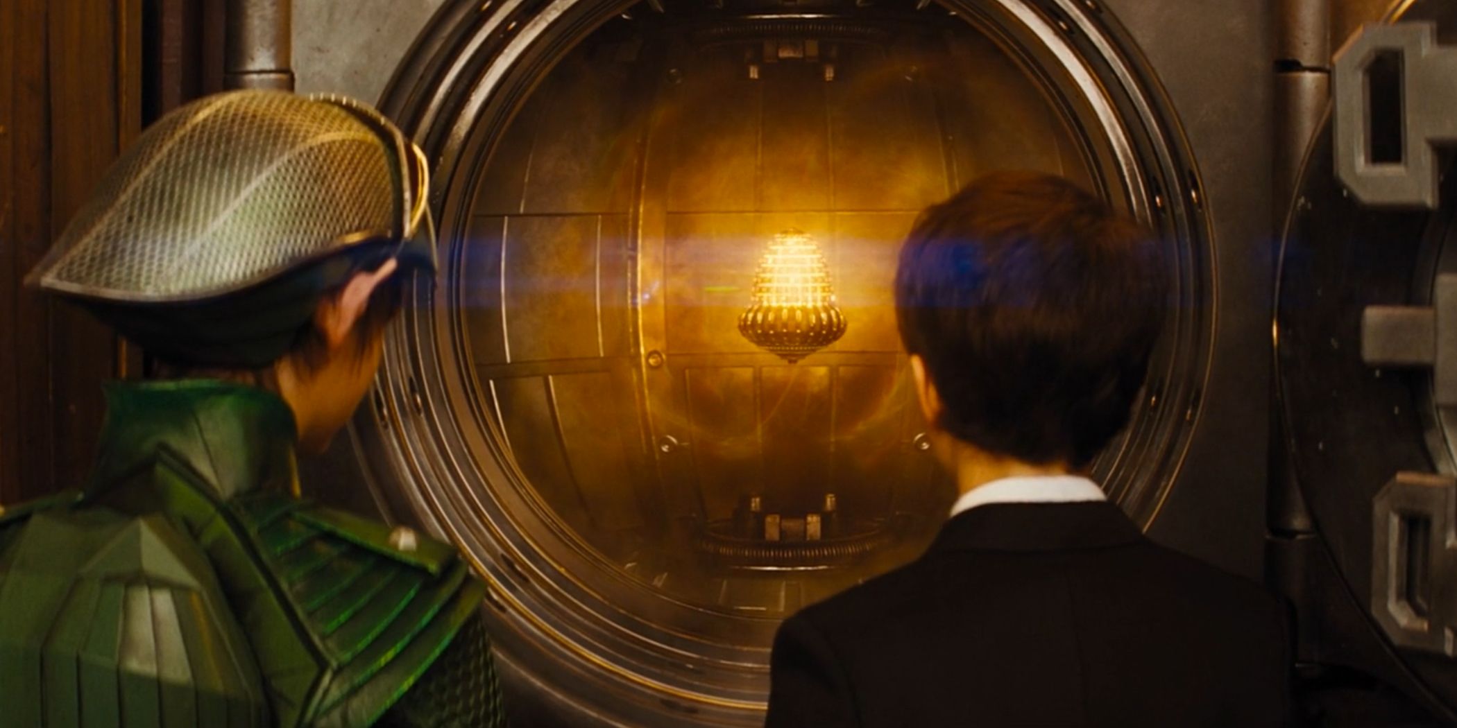 Holly short and Artemis Fowl standing in front of a vault that contains the Aculos