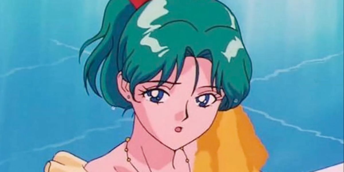 Upon her arrival in the series, most of the main characters thought she was a handsome boy! Haruka states several times in the show that she is "both man and woman" while also dressing in feminine and masculine clothing. By her side is Michiru, her girlfriend in the show. While it is up to fan's interpretations of what she means by "both man and woman", Haruka is definitely non-binary concerning her presentation, gender identity, and pronoun usage. Fans speculate she could be intersex, while oth
