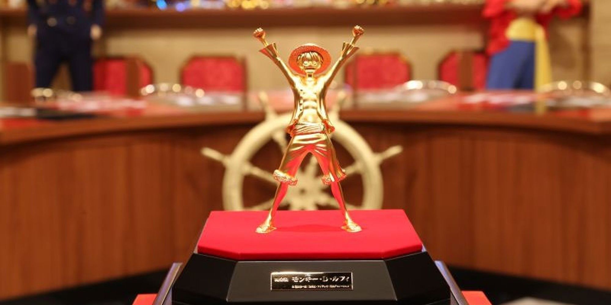 Image shows the gold figure of Monkey D. Luffy from One Piece